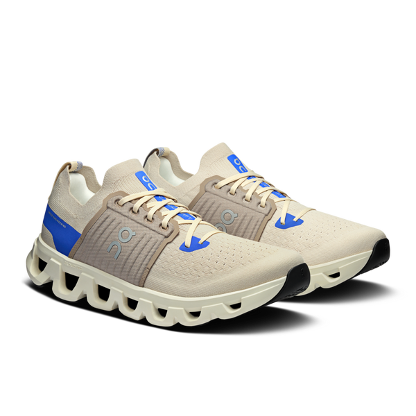 These On shoes have a grey saddle in the midfoot area of the shoe.