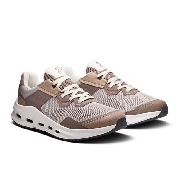 Pair of brown and gray sneakers on a white background