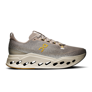 Gray rmen's On unning shoe with a yellow logo on a white background.