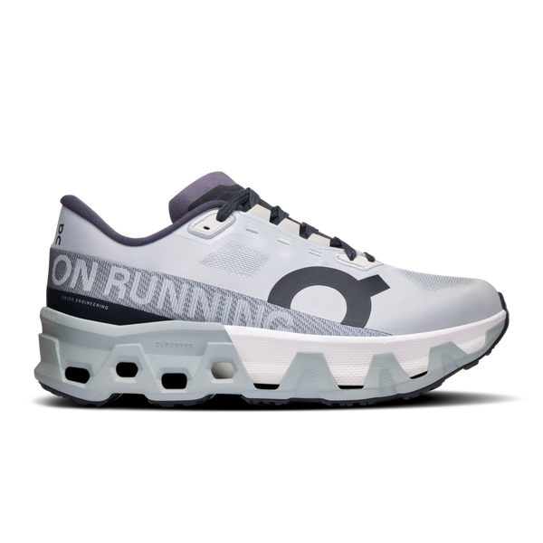A pair of white and gray On Running sneakers with a distinctive circular logo on the side.