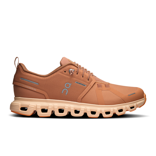 A pair of brown On brand athletic shoes with a waterproof upper and a white sole.