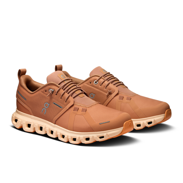 A pair of women's On casual shoes with a waterproof upper material.