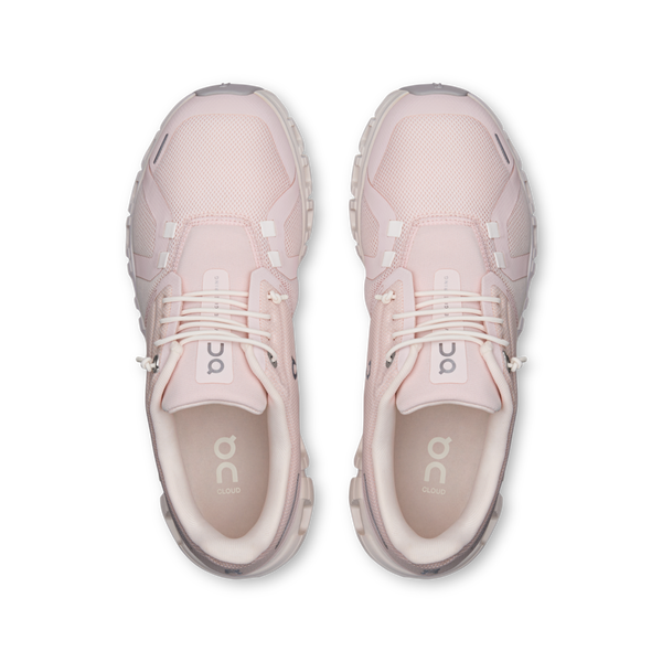 Pair of pink sneakers on a white background