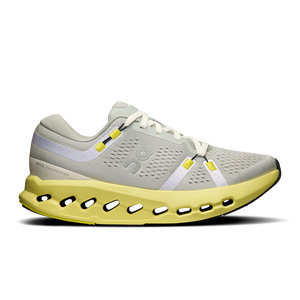A pair of women's athletic shoes with a gray upper and yellow accents, featuring a lightweight design with visible cushioning units.