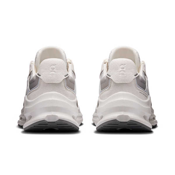 White sneakers with a brand logo on a white background