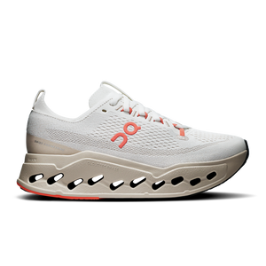 White women's running shoe with a unique sole design on a white background.