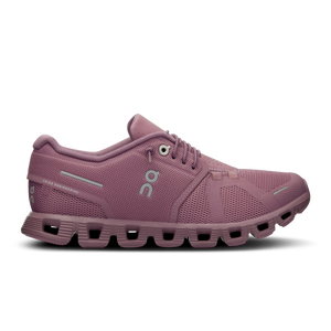 Pink running shoe with a white background.