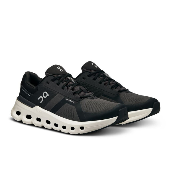 Black running shoes with white sole on a white background.
