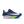 Blue and white Nike running shoe with green sole on a white background.