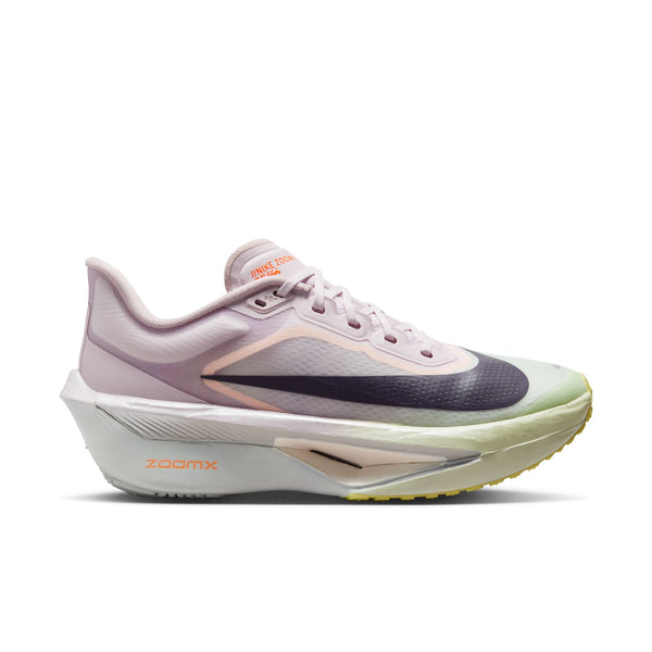 White running shoe with purple and green accents on a white background