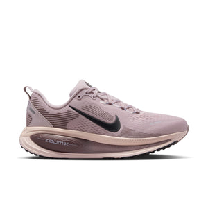Pink and rose colored Nike running shoe with black Nike logo on a white background.