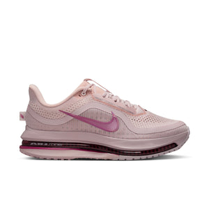 Women's pink Nike running shoe on a white background.