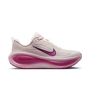 Pink and white women's running shoe  with a visible Nike logo on a white background.