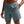 Person wearing teal athletic shorts with a Nike logo on a white background