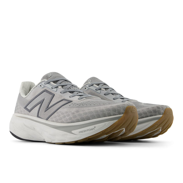 This grey running shoe has a gum sole outsole.