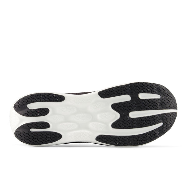 Close-up of a shoe sole with black and white design on a white background.