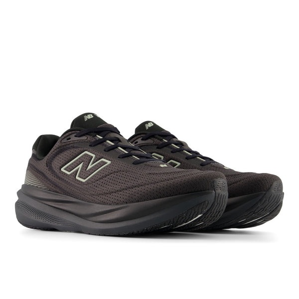 Pair of black New Balance sneakers on a white background.