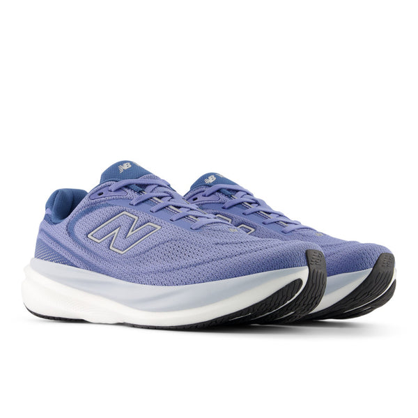 A pair of blue new balance running shoe with New Balance logo on a white background.