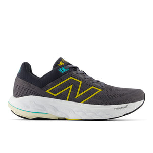 This image displays the Men's 860 V14 running shoe by New Balance, featuring a sleek dark grey upper with bold yellow accents and a white sole. The shoe is designed for optimal comfort and support, highlighted by its robust structure and stylish color contrast.