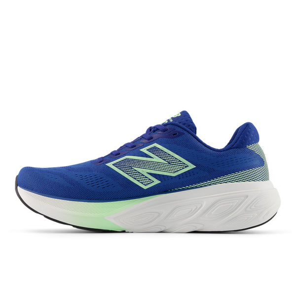 The medial side of a blue running shoe with green accents on a white background.