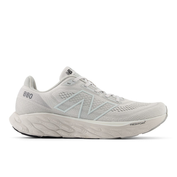 This men's new balance running shoe has a very soft look to the upper due to teh light grey and white colors that are used