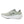Green running shoe with New Balance logo on a white background.