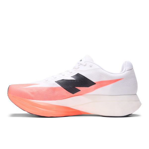 The medial side of a NB running shoe with orange sole and black logo.