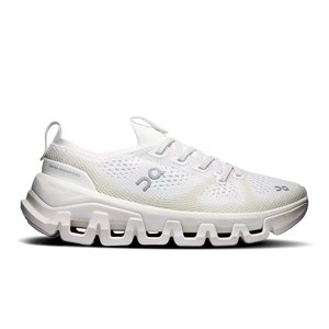 White sneaker with brown accents on a black background