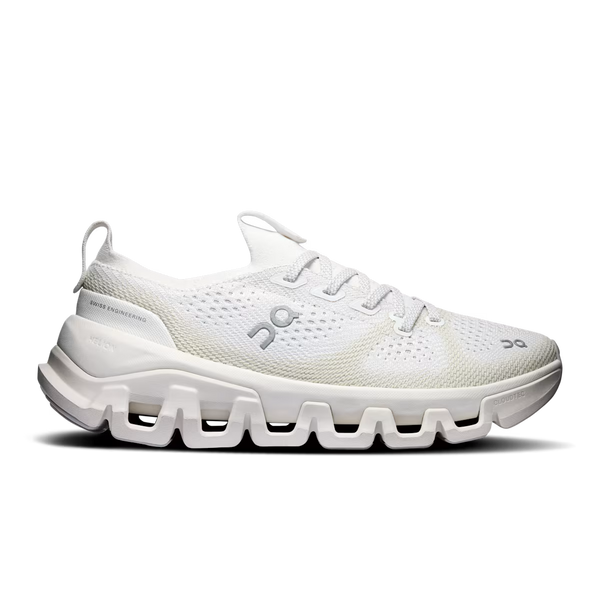 White sneaker with brown accents on a black background