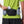 Person wearing a black waist bag with Nathan branding, holding a phone and water bottle.