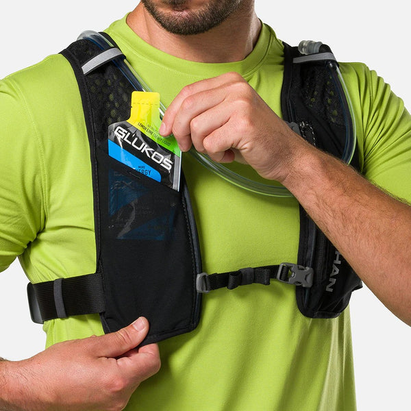 Person wearing a black hydration vest with GLUKOS branding on a white background