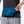 Person wearing a blue waist pack with 'Nathan' branding, holding a water bottle.