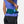Person wearing a green waist bag with Nathan branding, holding energy gels.