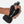 Hand holding a black water bottle with a wrist strap against a white background