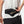 Person wearing a black waist bag with 'Nathan' branding on a white background
