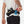 Person wearing a black hydration belt with Nathan and Elukta brands on a white background