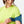 Woman wearing a blue Nathan sports arm band on a white background