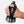 Hand holding a water bottle with a black grip and strap on a white background
