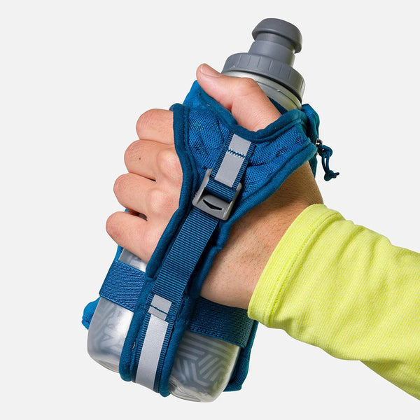 Hand holding a blue water bottle holder with a gray water bottle on a white background