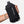 Black Nathan water bottle holder held by a person with a tattoo on a white background