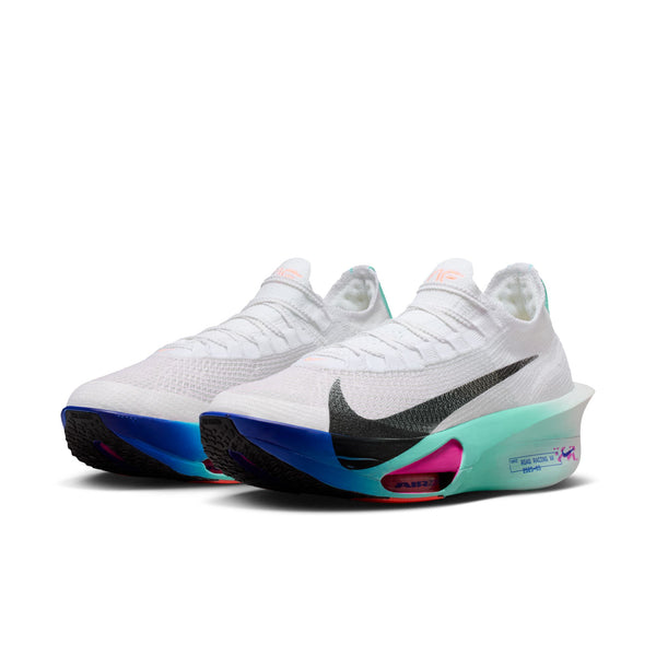 White Nike running shoes with colorful soles and a big Swoosh on a white background.