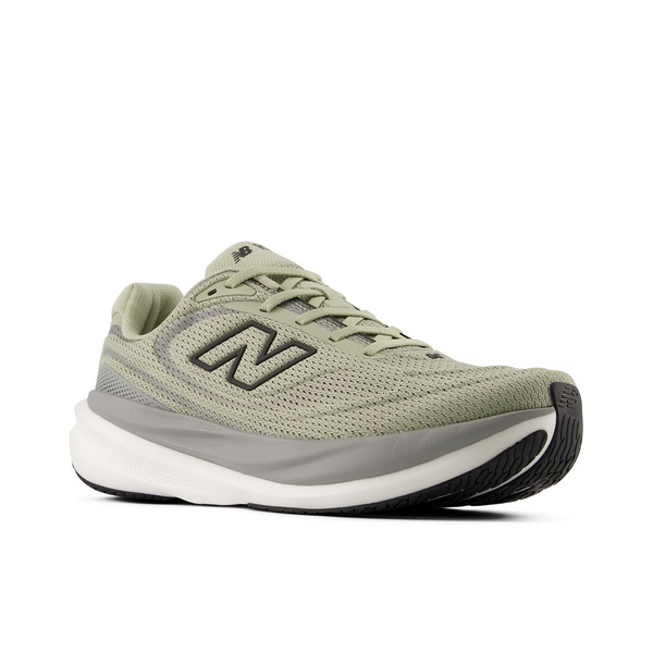 Green running shoe with white sole on a white background