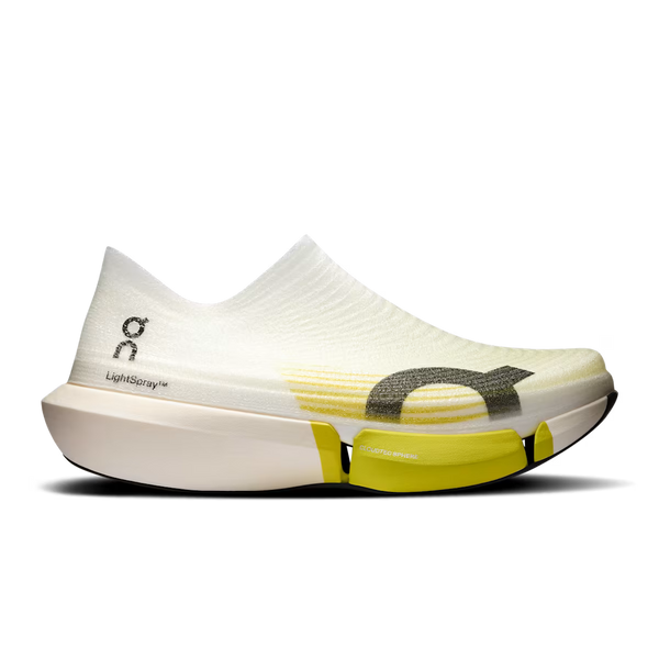 White running shoe with yellow accents on a white background