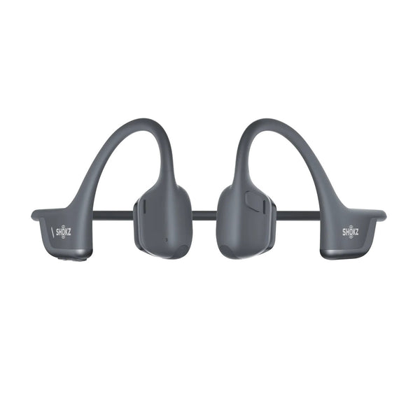 Pair of gray wireless earbuds on a white background