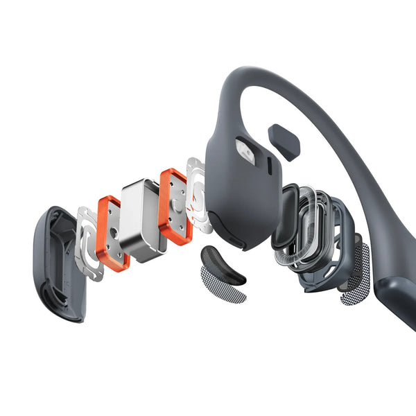 Disassembled Bluetooth headset with its components on a white background