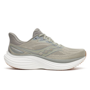 Gray and green running shoe on a white background