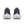 Navy running shoes with white soles on a white background