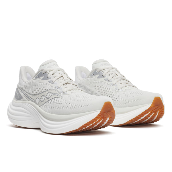 White running shoes with brown soles on a white background