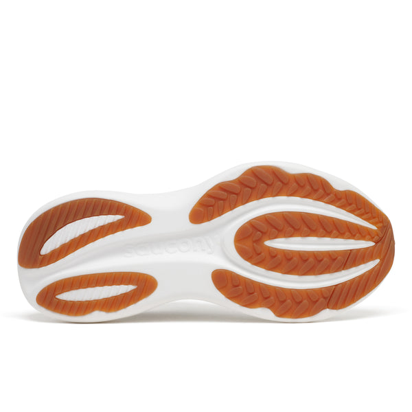 Close-up of a shoe sole with orange and white design on a white background