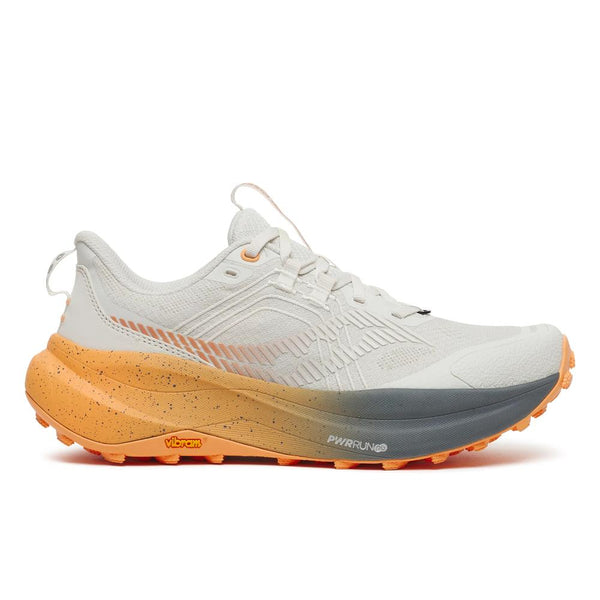 White running shoe with orange and gray sole on a white background